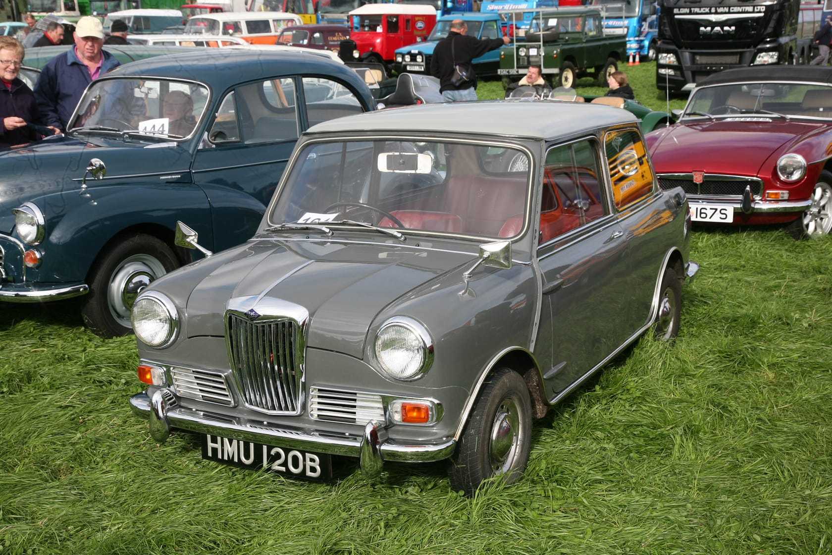 A grey Riley Elf saloon at a show, front three-quarter view showing the traditional grille