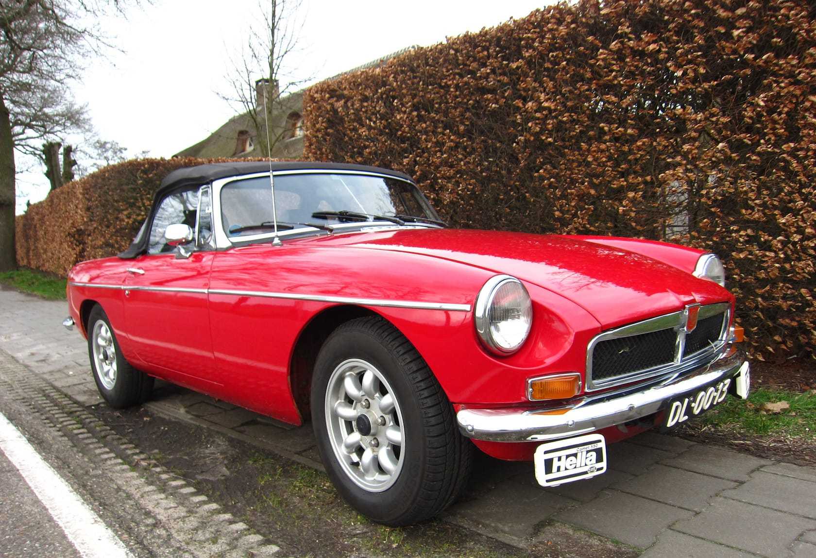 A red MG MGB roadster with Rostyle wheels, front three-quarter view