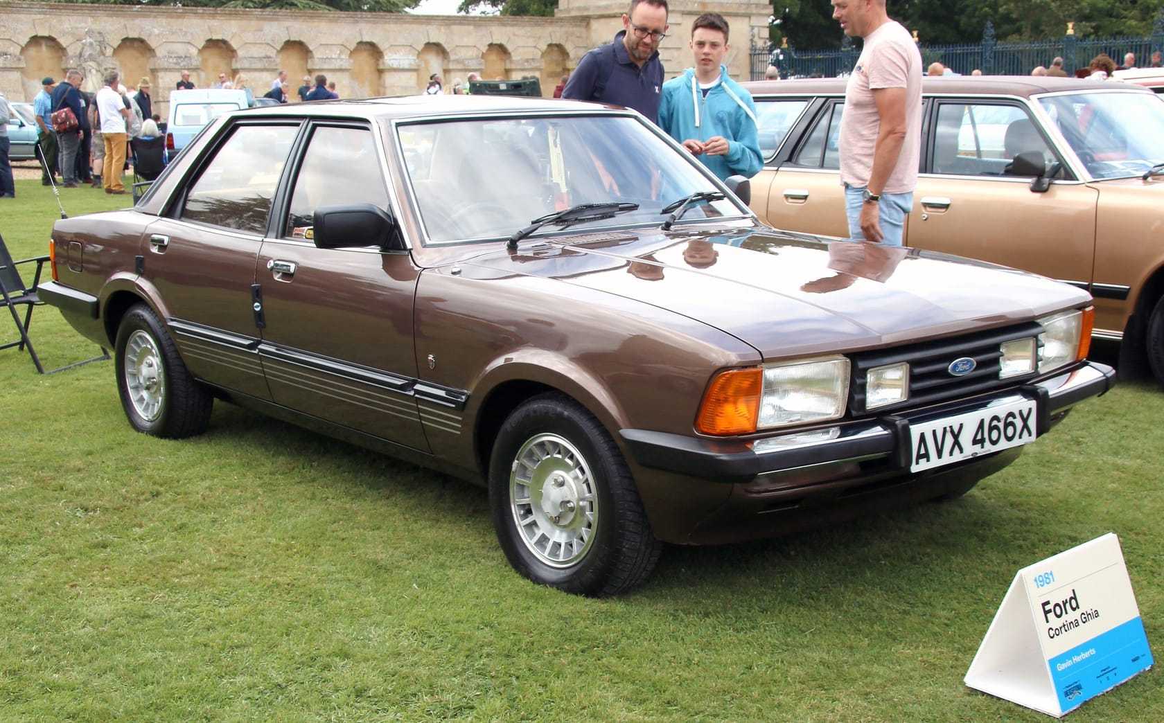 A bronze 1981 Ford Cortina Ghia four-door saloon, the Cortina 80 facelift, on display at a classic car show