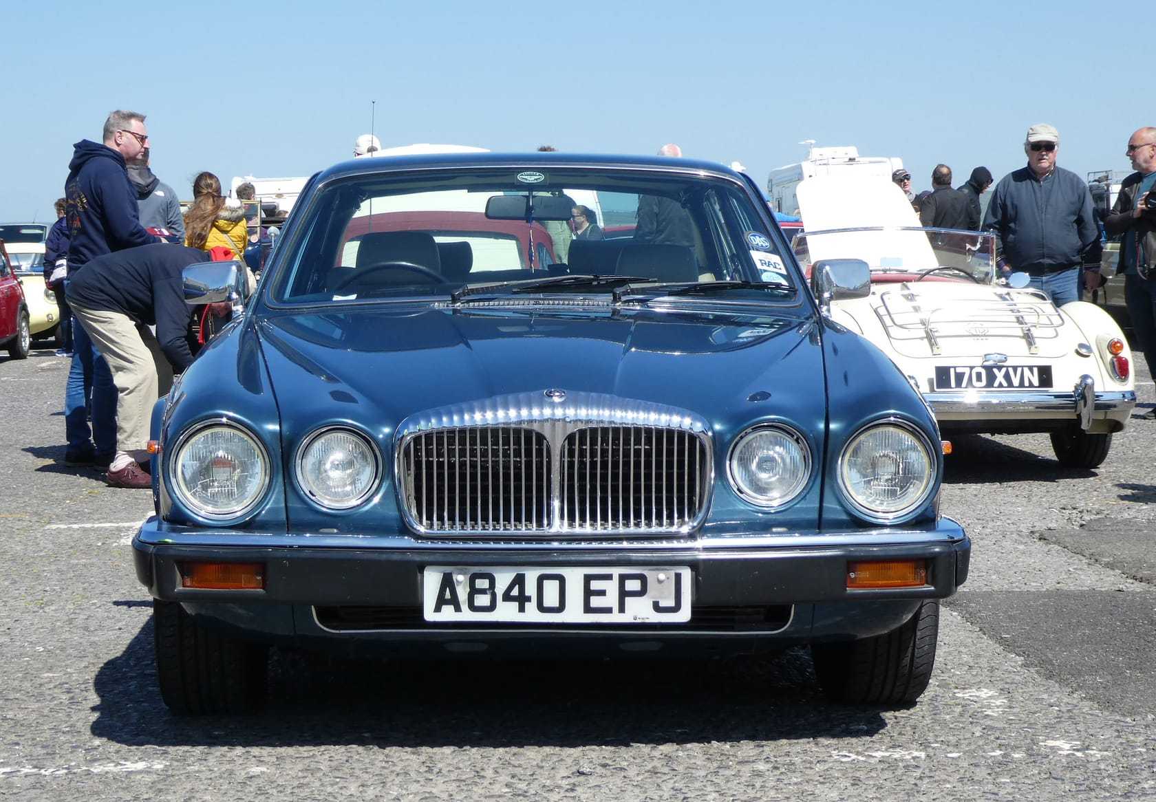 A dark blue 1984 Daimler Sovereign 4.2 Series 3 with a UK registration at a seafront classic car show