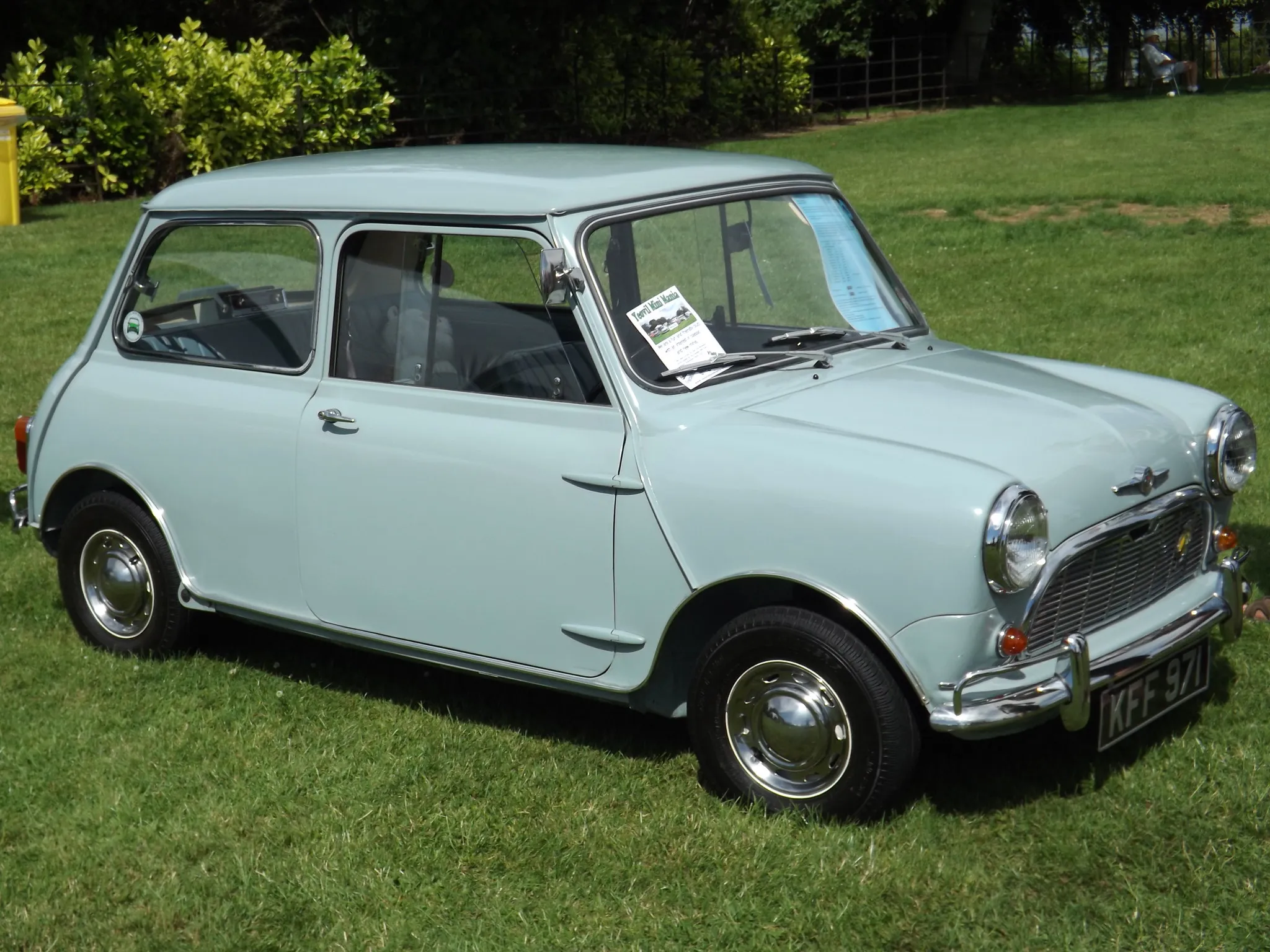 A pale blue 1960 Morris Mini-Minor at a show, side view