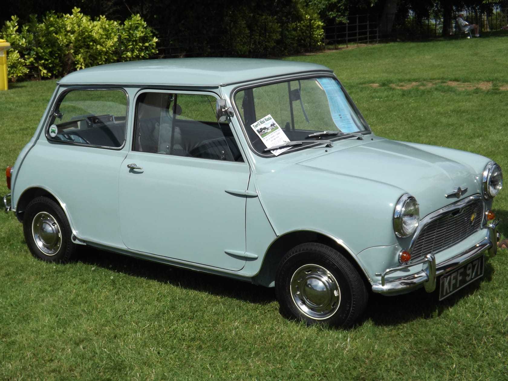 A pale blue 1960 Morris Mini-Minor at a show, side view