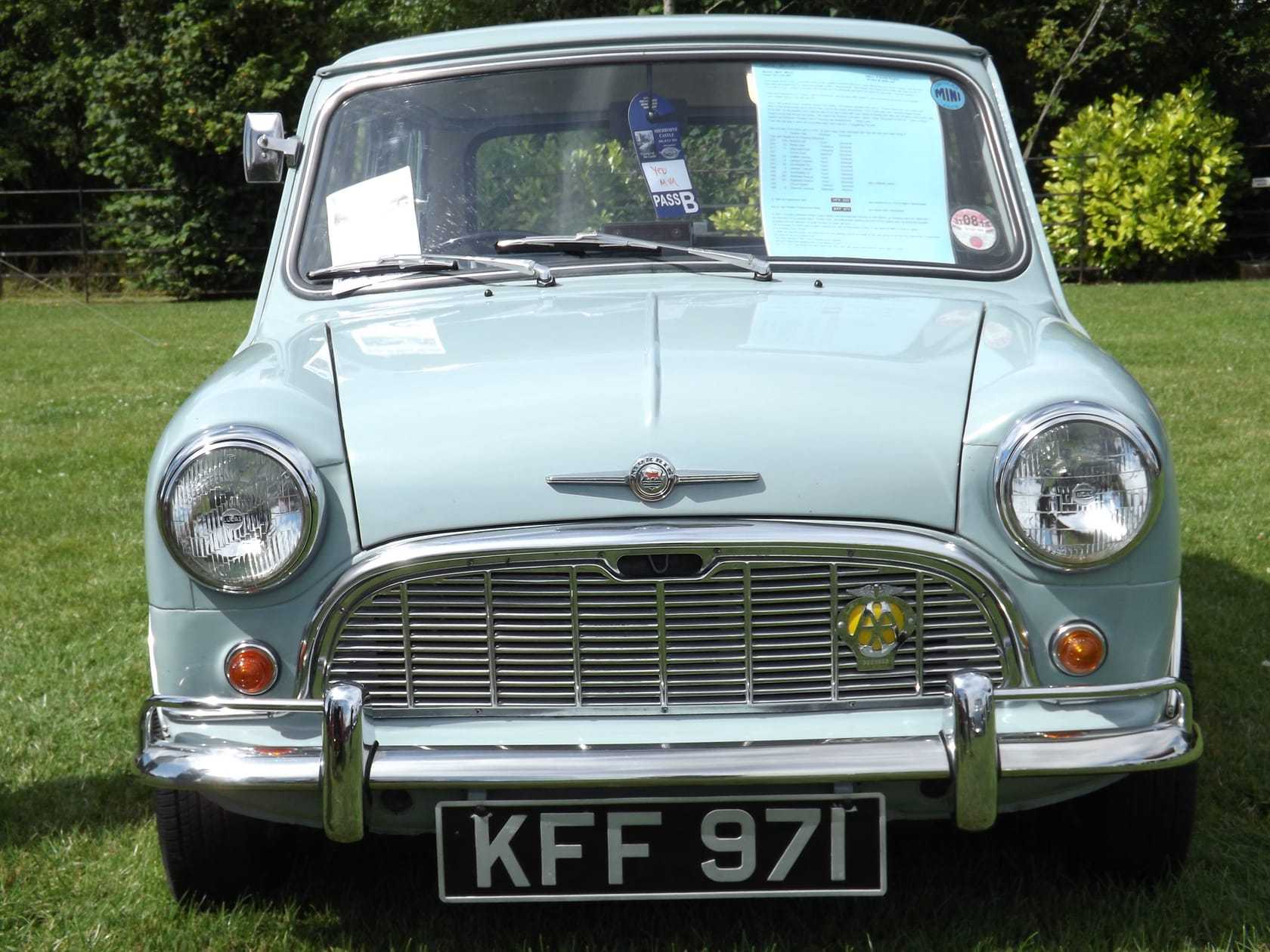 A pale blue 1960 Morris Mini-Minor at a show, front view
