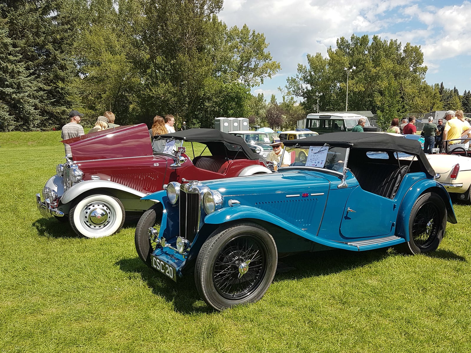 A dark MG TA of 1938 at a show, front three-quarter view