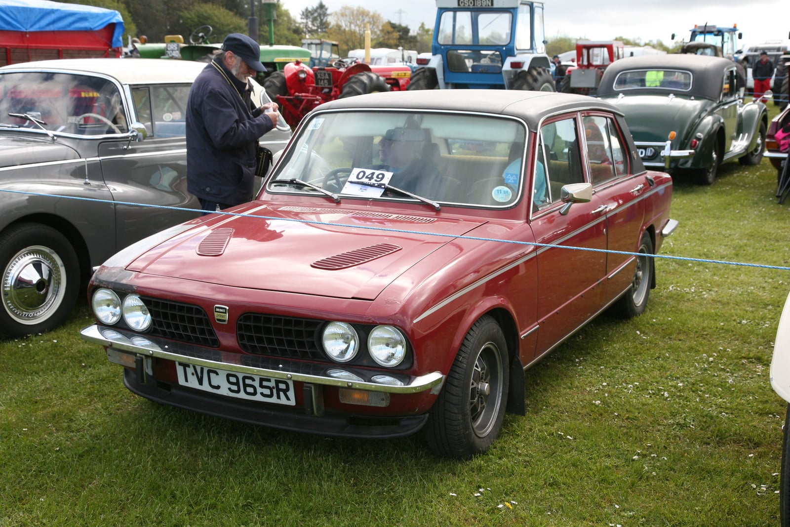 An orange Triumph Dolomite Sprint, front three-quarter view at a show