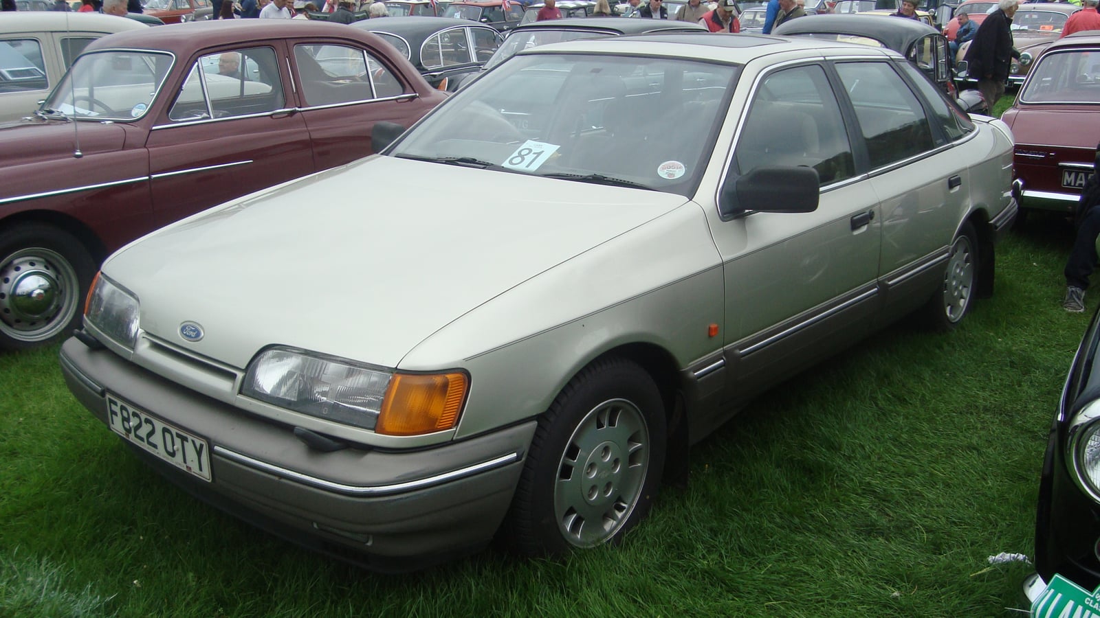 A cream Ford Granada Mk3 hatchback at a show, front three-quarter view