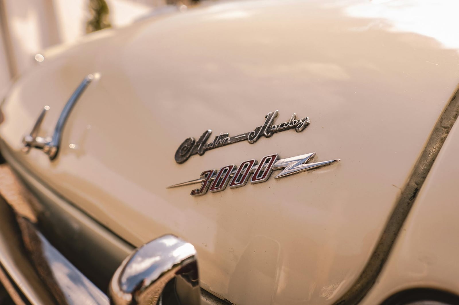 The Austin-Healey 3000 bonnet script and 3000 badge in chrome and red