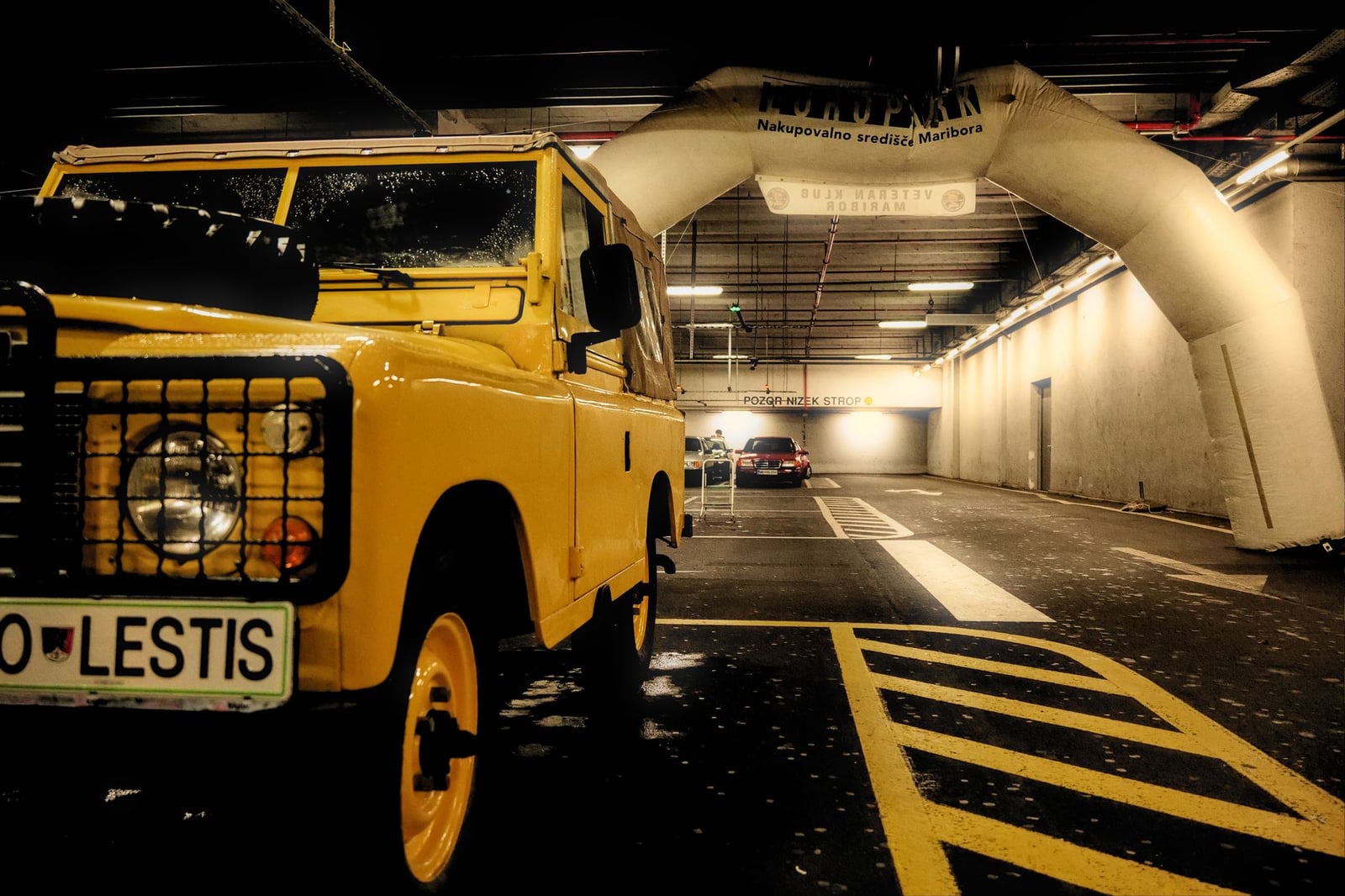 A yellow short-wheelbase Land Rover Series III hardtop