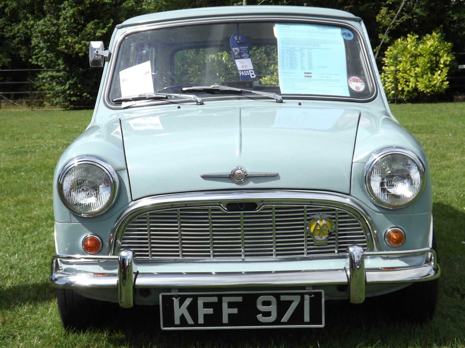 A pale blue 1960 Morris Mini-Minor, front view showing the Morris grille