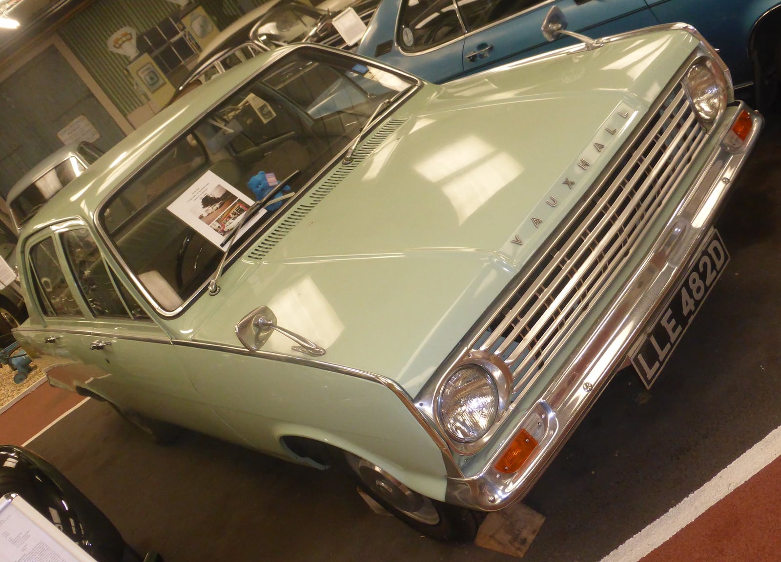 A pale green Vauxhall Victor 101 (1966) shown from a high front three-quarter angle in a museum