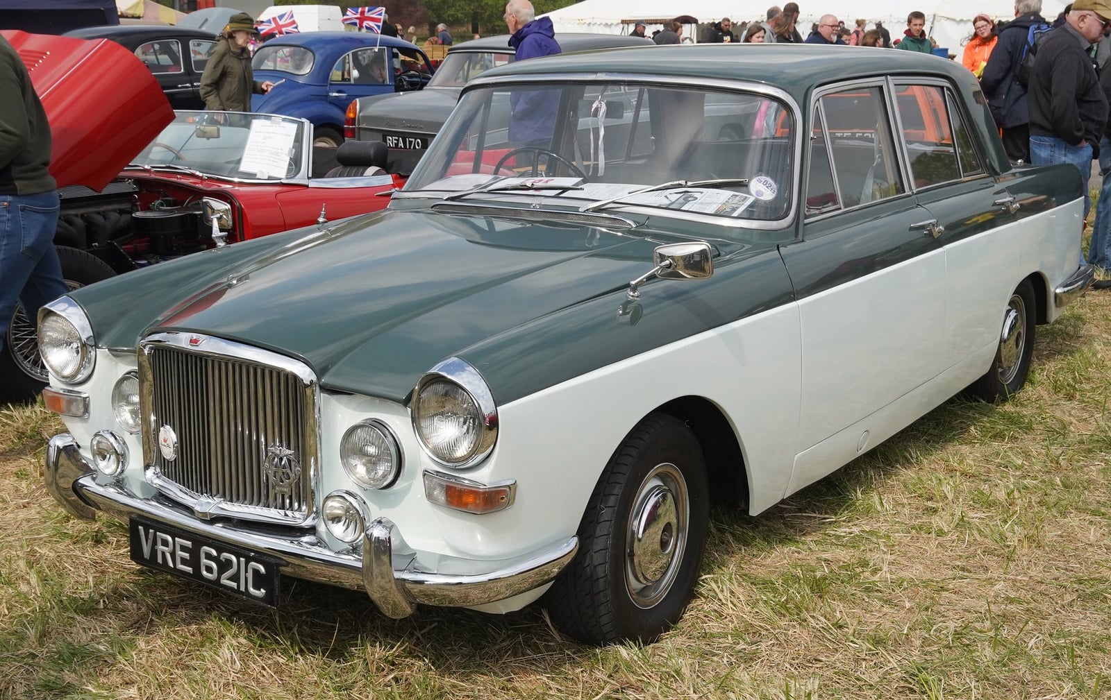 A two-tone grey-over-ivory Austin Princess Vanden Plas 4-Litre limousine (C plate, 1965), front three-quarter view at an outdoor classic car show